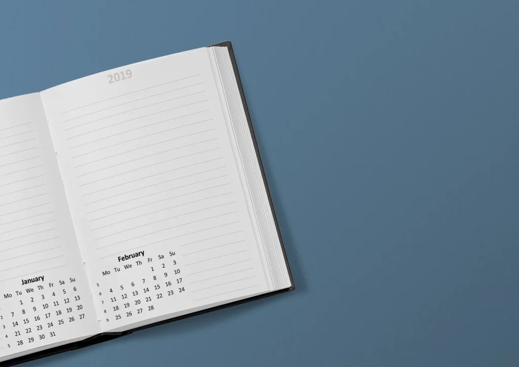Day planner over a blue-gray background.
